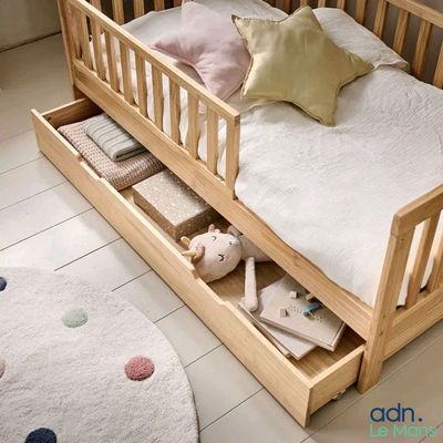 a bed with a wooden frame and a bed with a mattress
