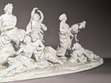 a statue of a group of people sitting on a bench