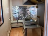 an image of a commercial kitchen with a large mural on the wall