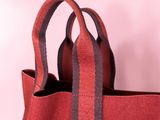 red canvas tote bag with black and grey stripes