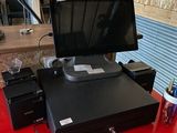 a red table with a monitor and a printer on it