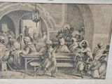 une vieille photo d'un groupe de personnes assises autour d'une table