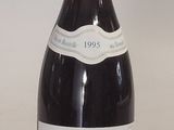 a bottle of wine that is sitting on a table