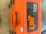 an orange case sitting on the floor next to a laptop