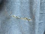 the jacket has a hole in it that has been torn off