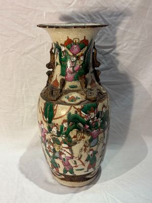 a vase that is sitting on a white surface