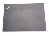 a laptop that is sitting on a white surface