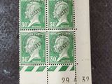 four stamps with a picture of a man ' s head on them
