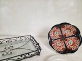 two plates and a tray sitting on a table