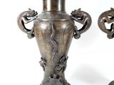 two vases that are sitting next to each other on a table