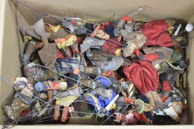 a cardboard box full of assorted toys in it