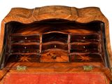an old wooden box with many drawers inside of it