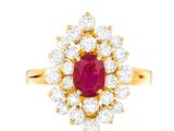 an oval ruby and diamond cluster ring