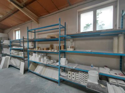 a room that has a lot of shelves in it