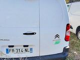 a white van that is parked in the grass