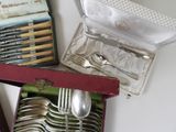 a box with a set of silverware in it on a table