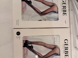 pair of scissors and a pair of shoes are on a table