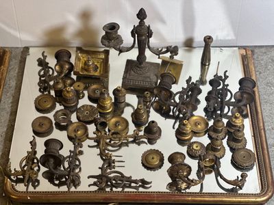 a mirror that has a lot of antique items on it