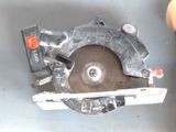 someone is using a circular saw to cut a piece of metal