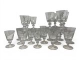 a lot of glasses that are sitting on a table