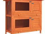 a wooden rabbit hut with two doors and a wire cage