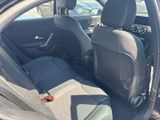 the back seats of a car are empty in a parking lot
