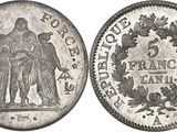 gros plan d'une pièce de monnaie sur laquelle figurent une femme et un homme