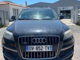 the front view of a black audi car parked in a parking lot