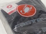 a black shirt with a scorpion on it in a plastic bag