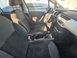 the interior of a car with black seats and a steering wheel