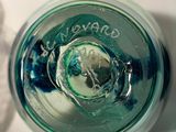 a close up view of a glass of water with ice in it
