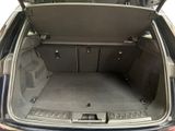 a trunk of a car with the back door open