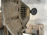 a picture of a dirty air conditioner sitting in a garage