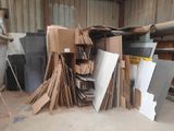 a large pile of cardboard and cardboard boxes in a warehouse