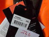 a tag on a jacket that is attached to it