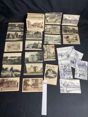 several old postcards of different types and sizes on a black surface