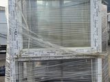 a small window that is sitting on a pallet