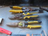 many different types of pliers and tools on the table