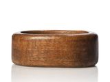 a close up of a wooden ring on a white surface
