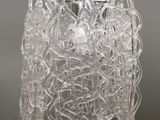 a close up of a glass chandelier hanging from a ceiling