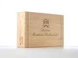 a close up of a wooden box with a bottle of wine in it
