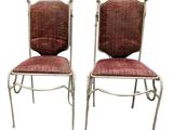 pair of vintage chairs with red upholstered cushions