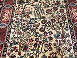 an oriental rug with a tree of life design on it