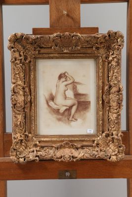 an old picture of a nude woman sitting on a chair in front of a mirror