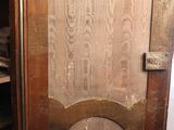 a wooden door with a glass panel on it