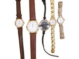 several different types of watches and bracelets on a white background