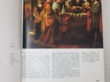an open book with a picture of a group of people in a room