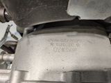 a close up of a motorcycle engine with a wren on it