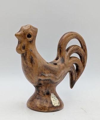 an image of a wooden rooster figurine on a white background