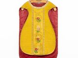an image of a yellow and red dress hanging on a hanger